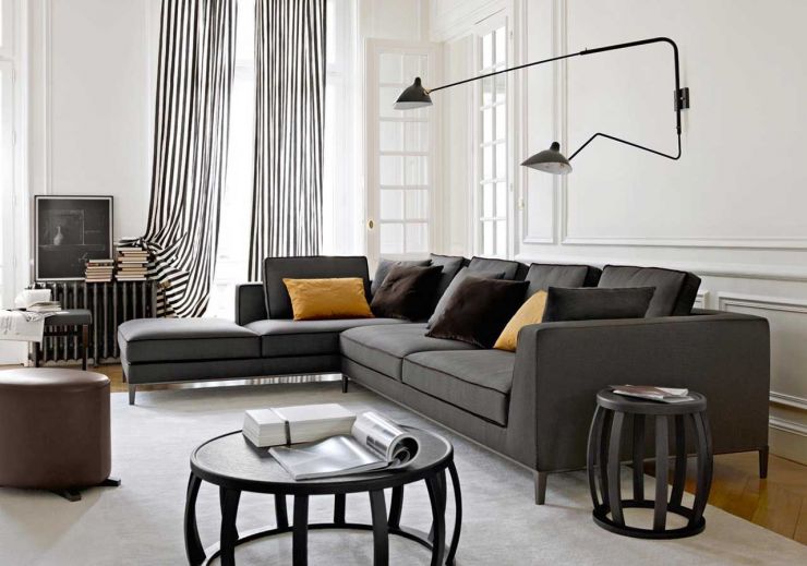 glamorous-white-living-room-color-ideas-with-black-sectional-sofa-and-brown-ottoman-furnished-with-round-black-table-also-completed-with-gray-window-curtains-ideas